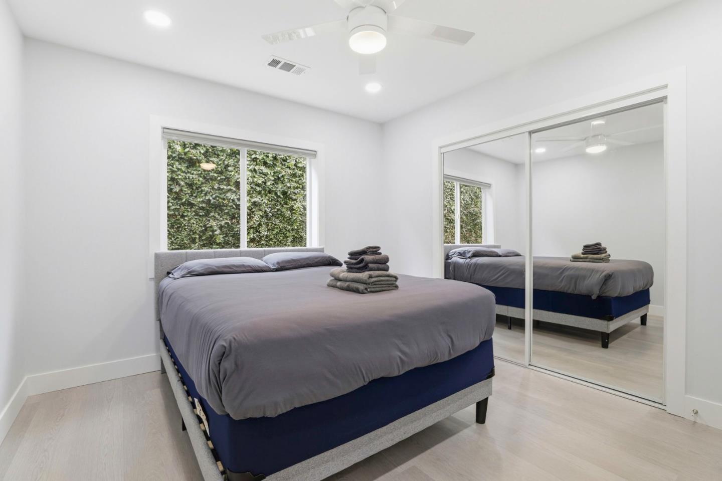 1802 Ponca Court Fremont, CA 94539 - Photo 15 of 28 a bedroom with a bed and a large window
