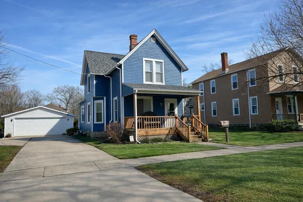 a front view of a house with garden