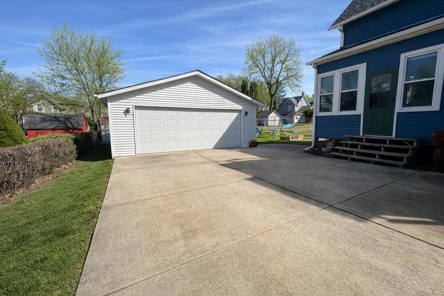 307 South 5th Street Oregon, IL 61061 - Photo 17 of 18 a front view of a house with a yard and garage
