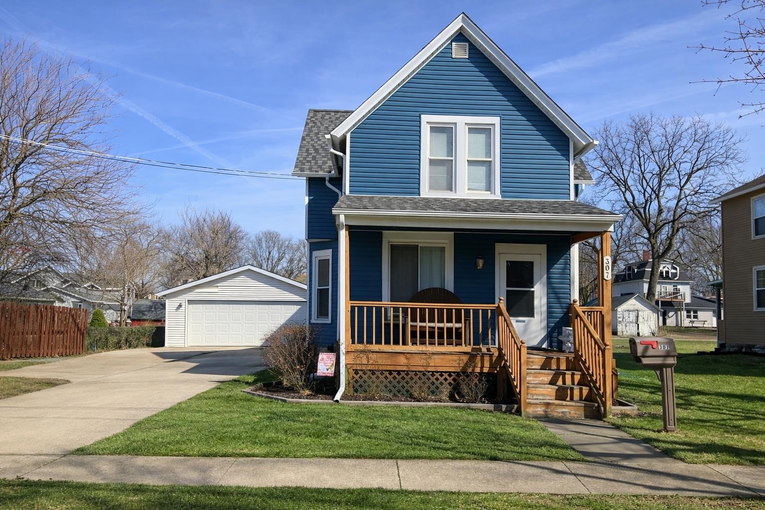 307 South 5th Street Oregon, IL 61061 - Photo 3 of 18 a front view of a house with a yard