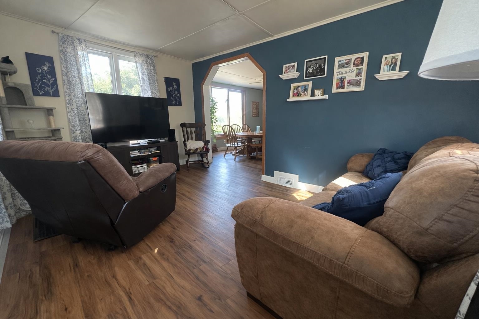 307 South 5th Street Oregon, IL 61061 - Photo 5 of 18 a living room with furniture and a flat screen tv