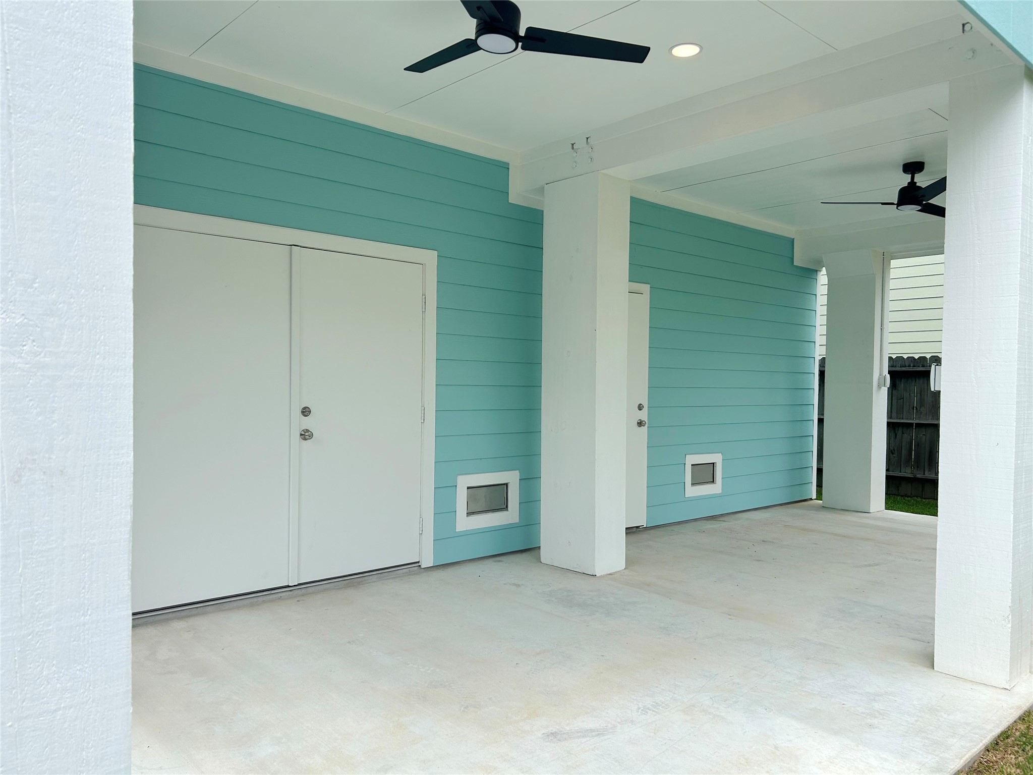 922 Elm Road Clear Lake Shores, TX 77565 - Photo 22 of 22 Double door access to patio and yard from garage