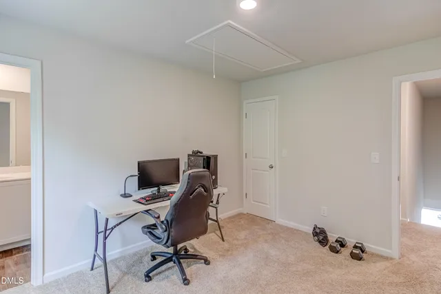 a view of a workspace with furniture