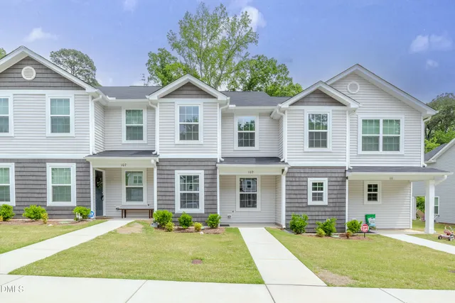 a front view of a house with a yard