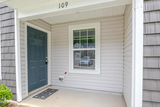 a view of a door and a window