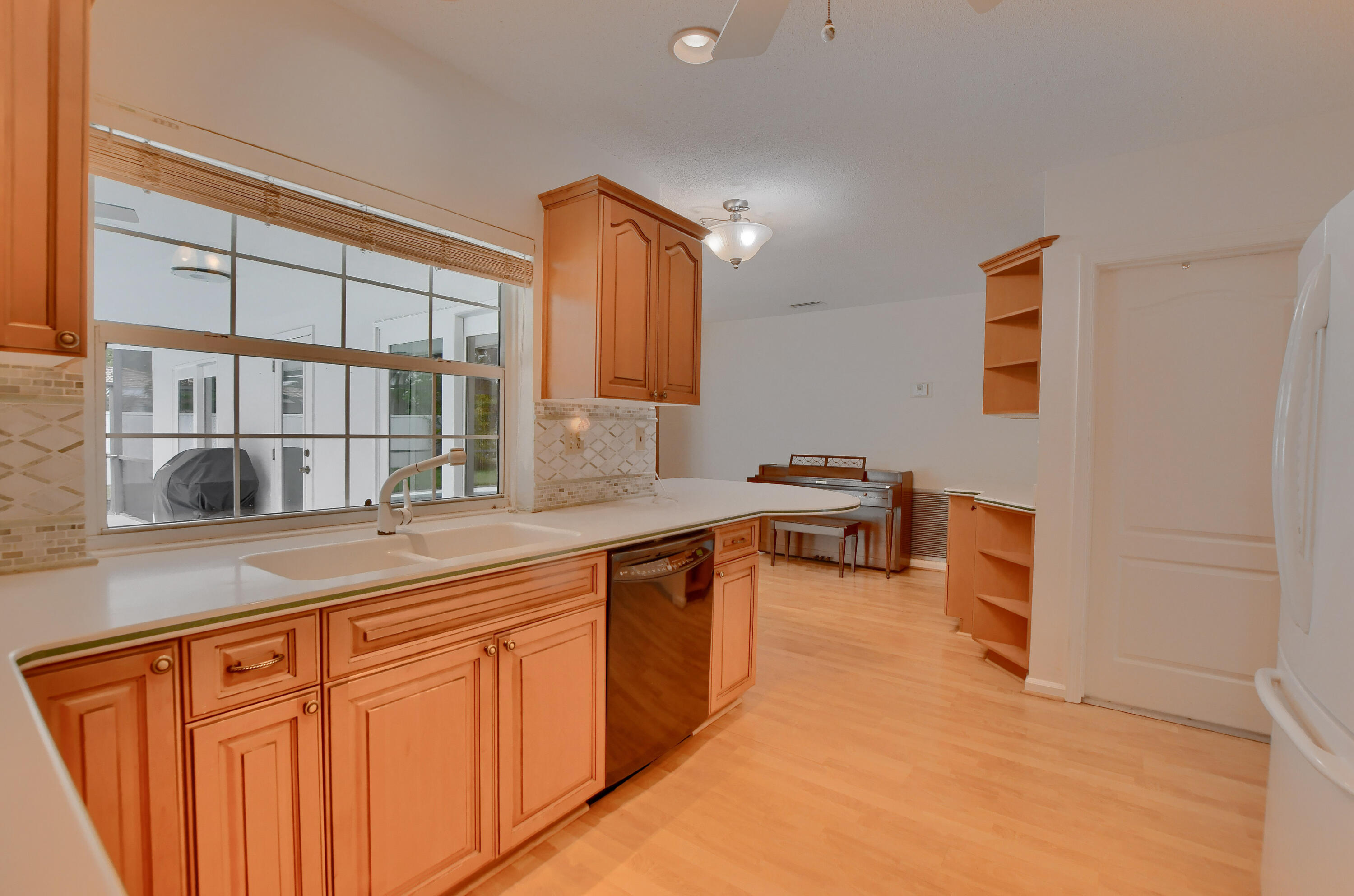 251 Southwest 9th Avenue Boca Raton, FL 33486 - Photo 11 of 37 a hall with a sink and a stove top oven