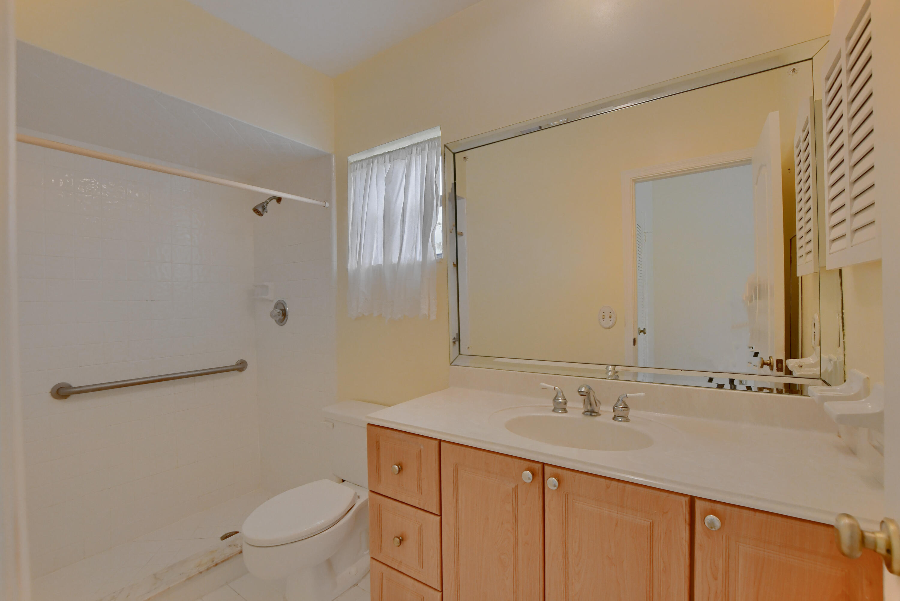 251 Southwest 9th Avenue Boca Raton, FL 33486 - Photo 17 of 37 a bathroom with a sink toilet and shower
