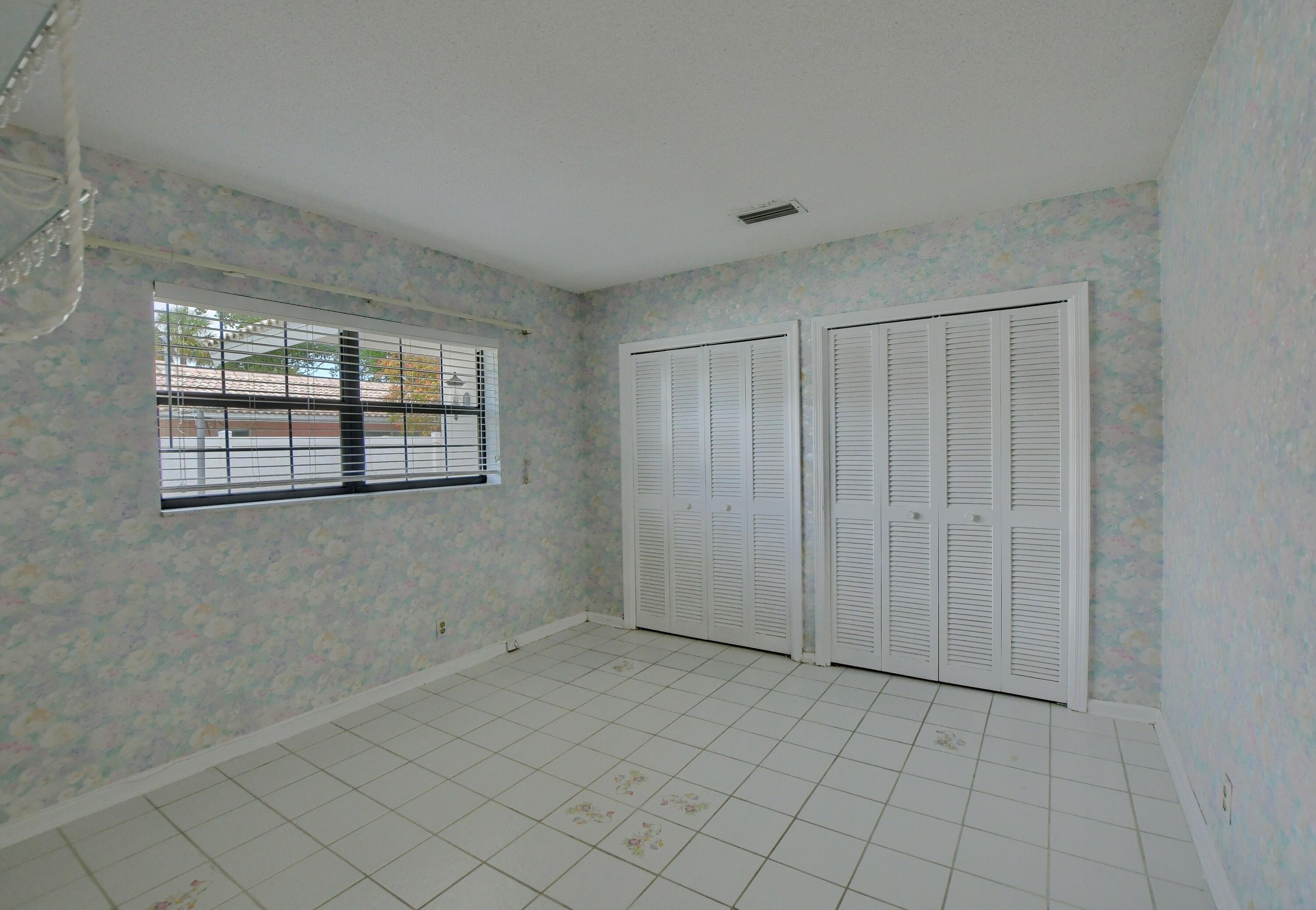 251 Southwest 9th Avenue Boca Raton, FL 33486 - Photo 18 of 37 a view of an empty room with windows