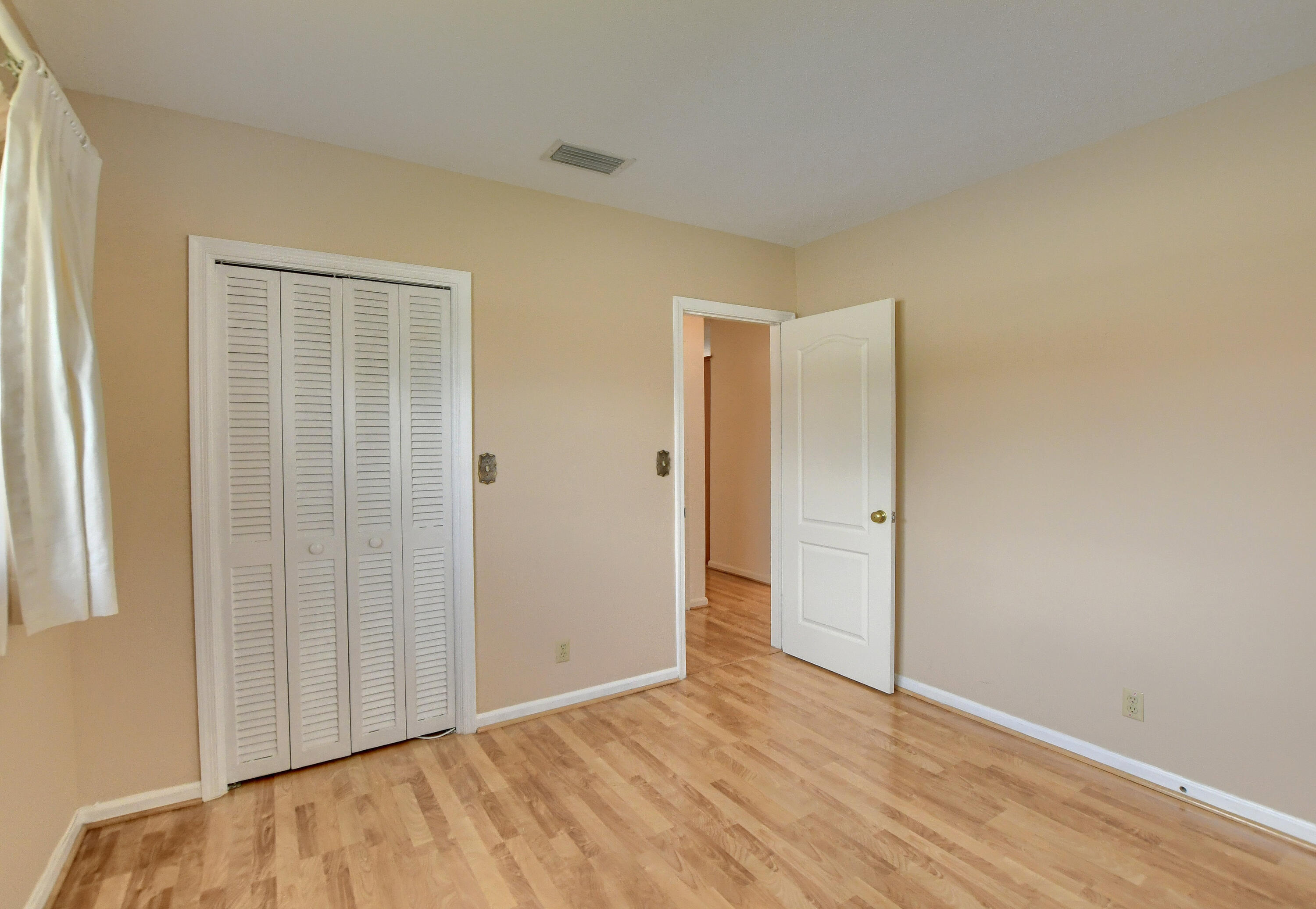 251 Southwest 9th Avenue Boca Raton, FL 33486 - Photo 21 of 37 an empty room with wooden floor and windows