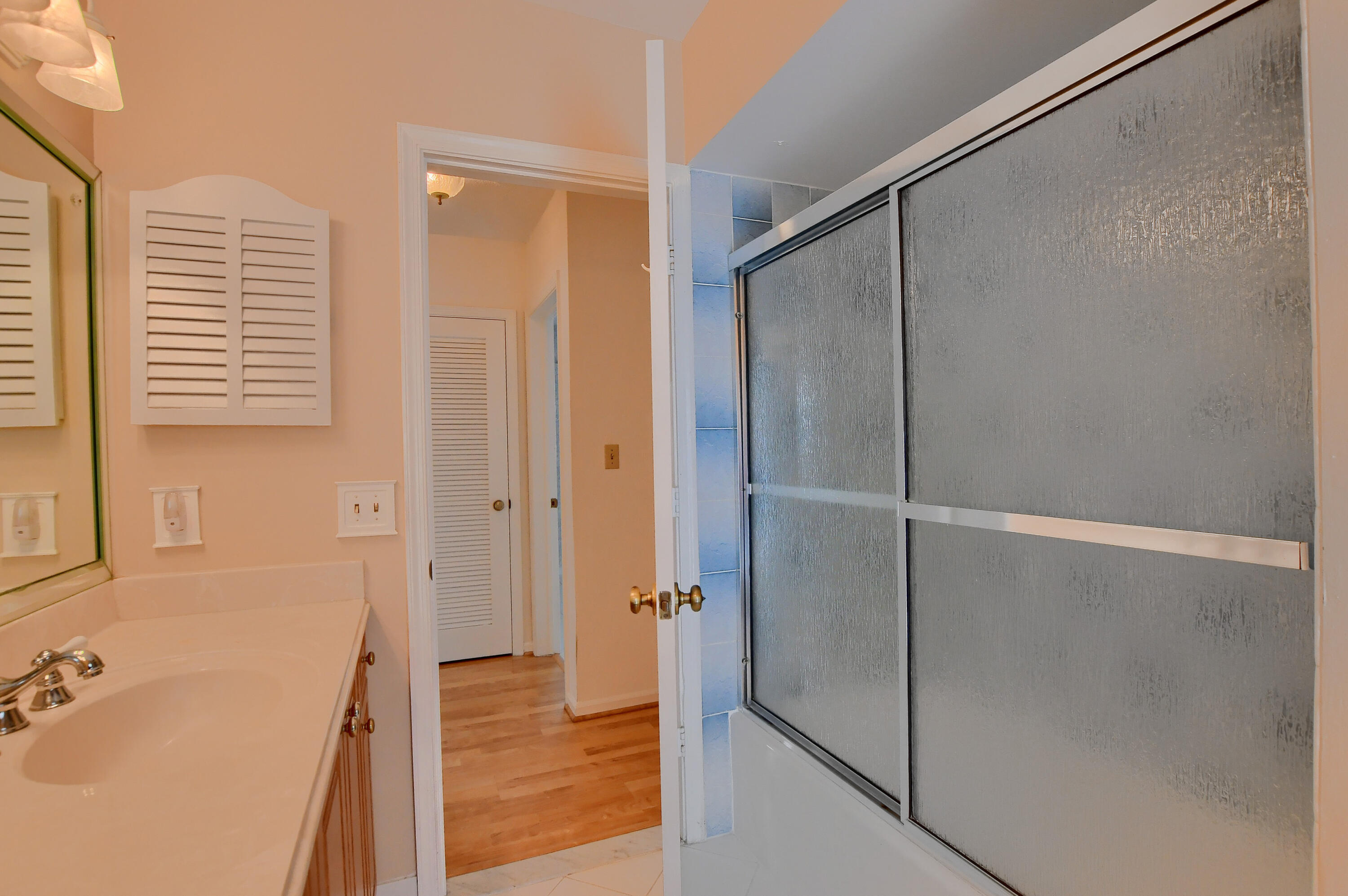 251 Southwest 9th Avenue Boca Raton, FL 33486 - Photo 23 of 37 a bathroom with a tub and shower