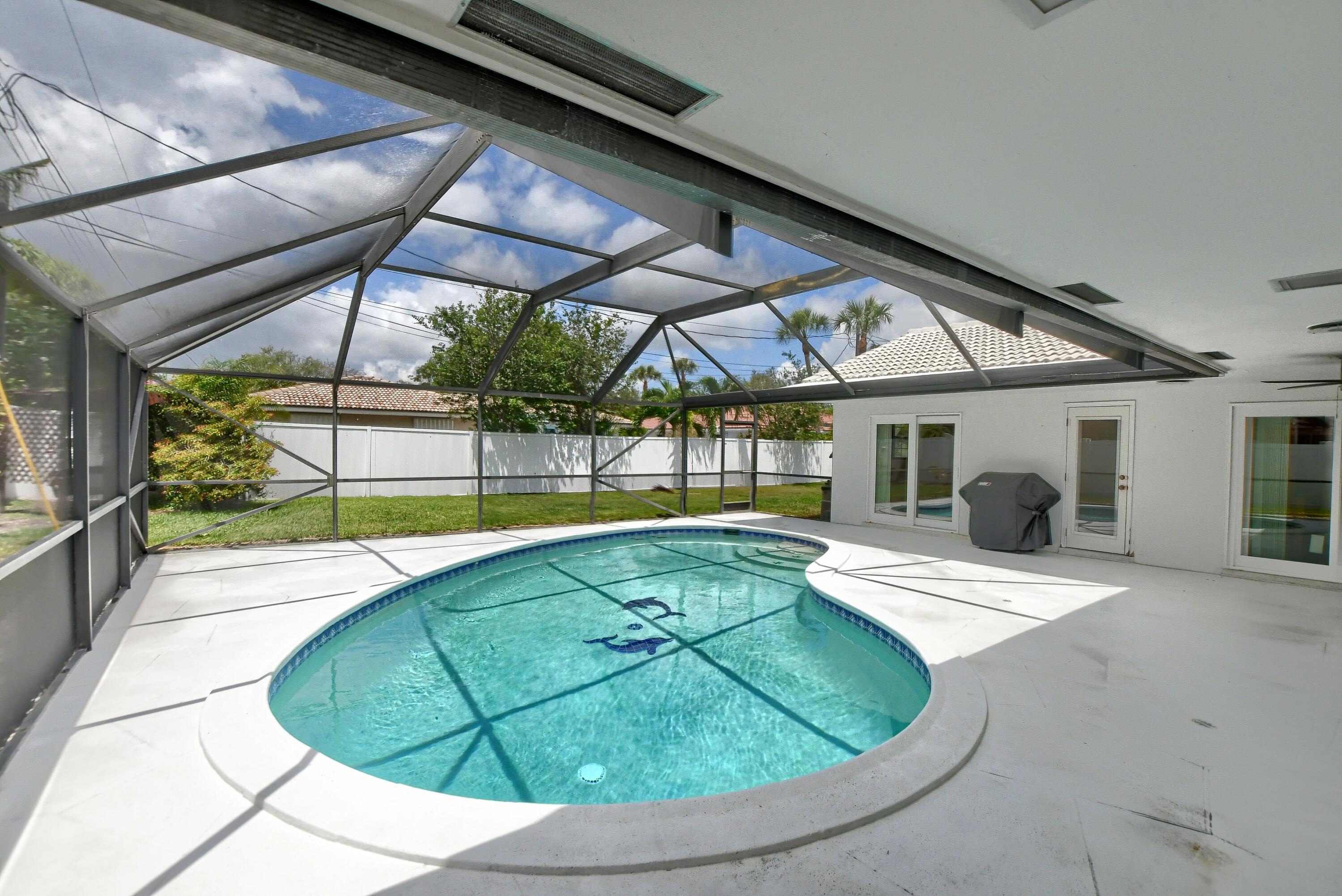 251 Southwest 9th Avenue Boca Raton, FL 33486 - Photo 29 of 37 a view of a swimming pool with an outdoor seating