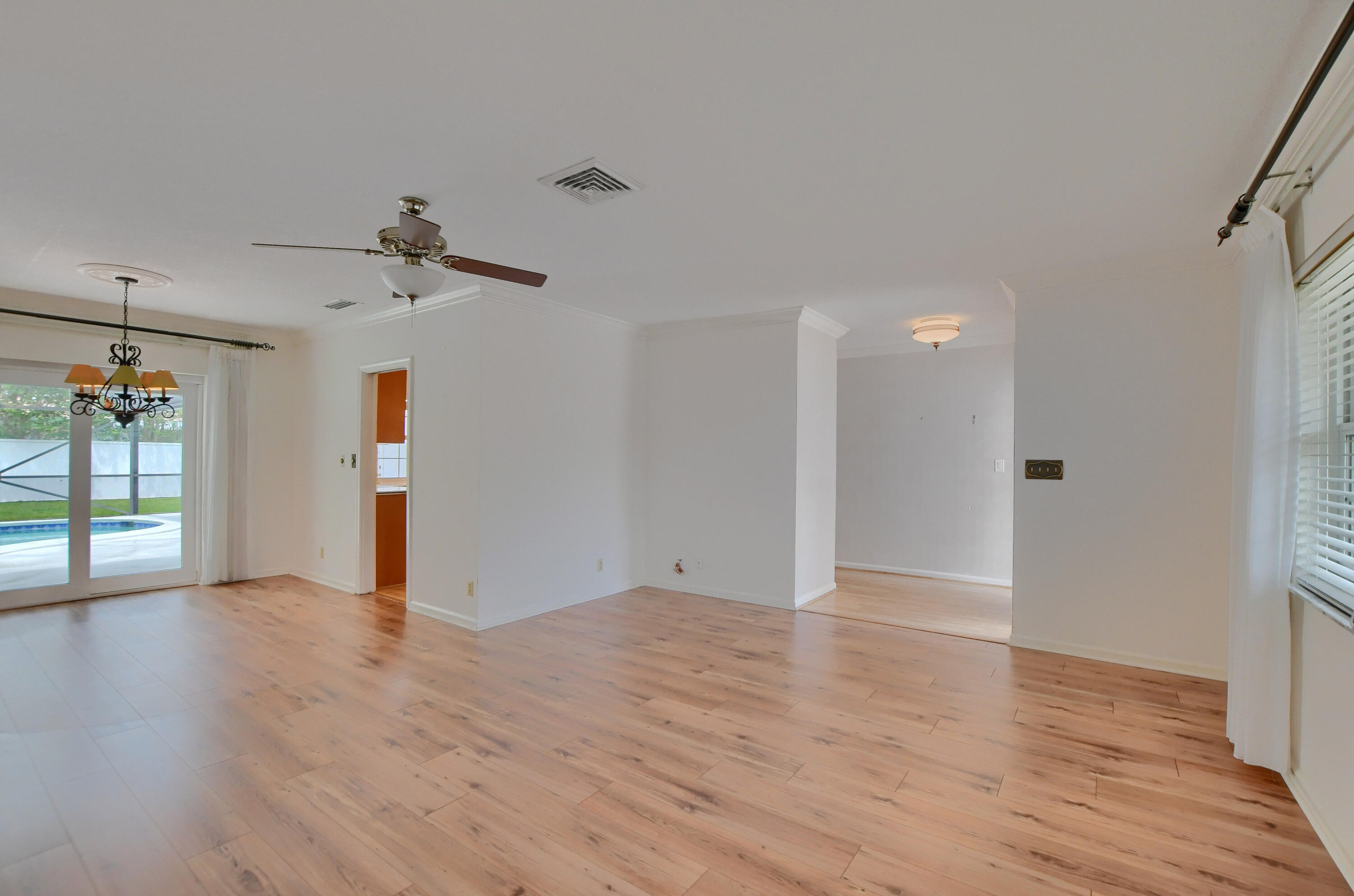 251 Southwest 9th Avenue Boca Raton, FL 33486 - Photo 5 of 37 a view of an empty room with wooden floor