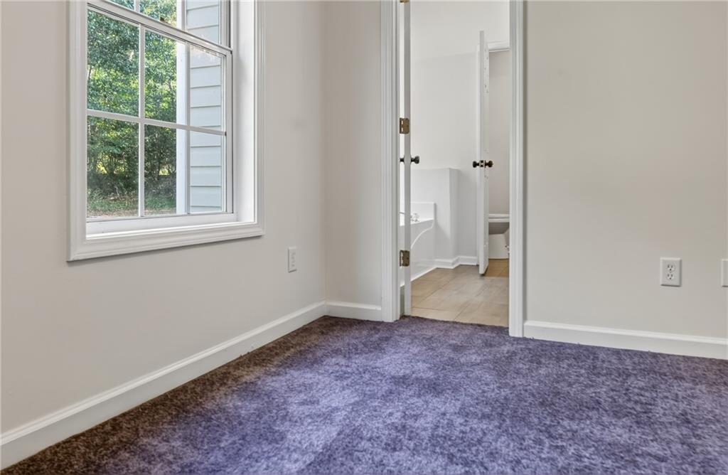 110 Chestnut Drive Covington, GA 30016 - Photo 14 of 27 a view of an empty room with a window