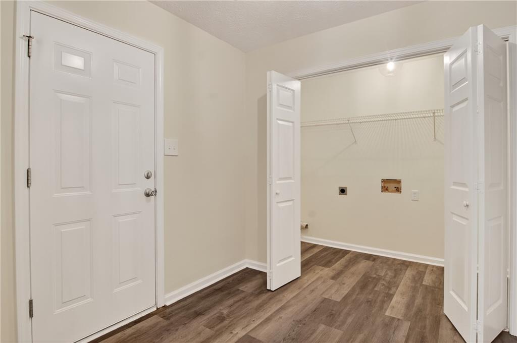 110 Chestnut Drive Covington, GA 30016 - Photo 24 of 27 an empty room with wooden floor