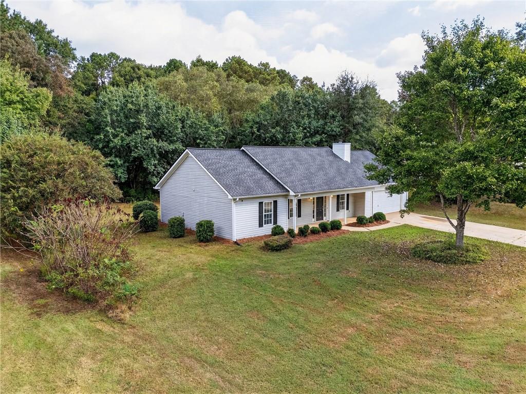 110 Chestnut Drive Covington, GA 30016 - Photo 4 of 27 front view of a house with a yard