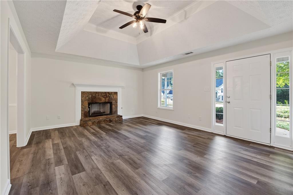 110 Chestnut Drive Covington, GA 30016 - Photo 10 of 27 wooden floor in an empty room with a window