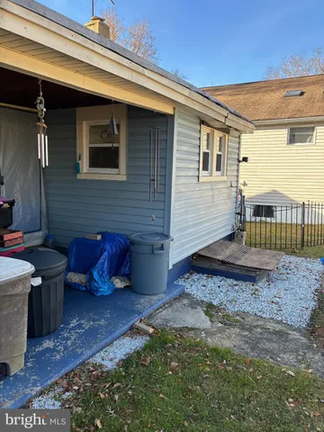 a view of a backyard with plants and a patio