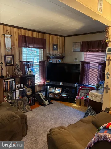 a room with furniture and a flat screen tv