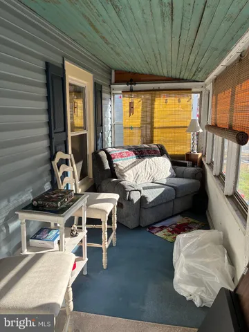 a front view of house with outdoor seating