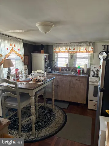 a kitchen with a sink appliances and cabinets