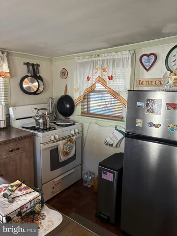 a kitchen with a stove and a microwave