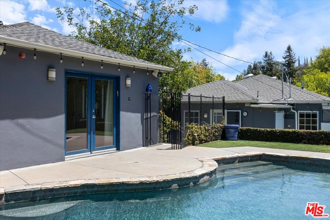 14041 Roblar Road Sherman Oaks, CA 91423 - Photo 3 of 47 a house with swimming pool in front of it