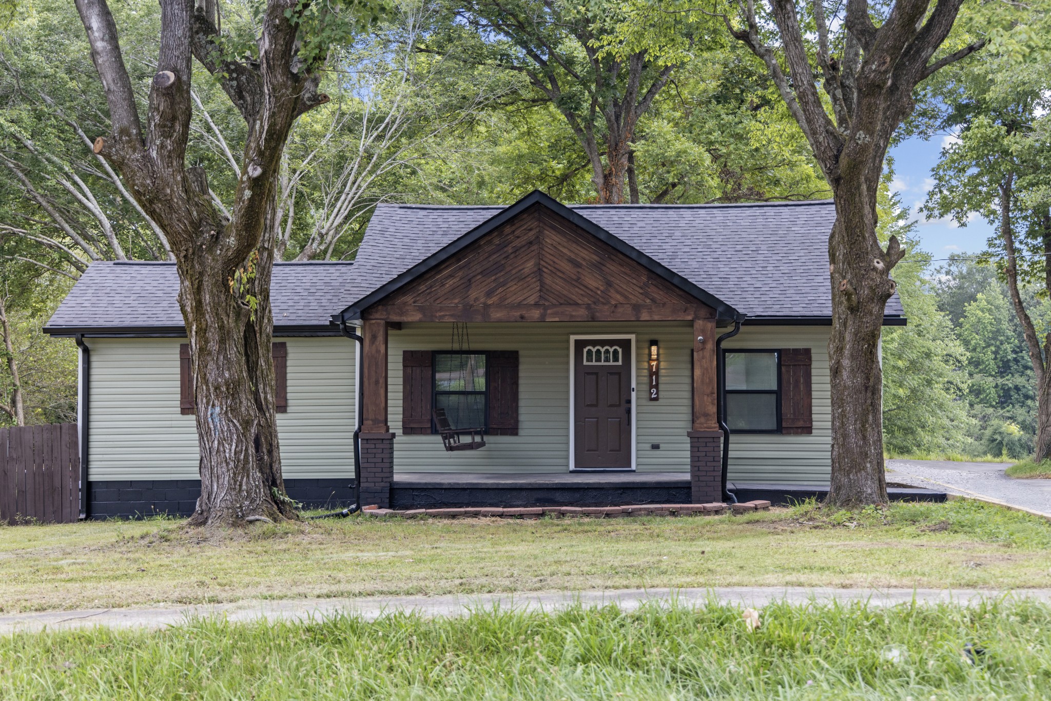 a house with trees in the background