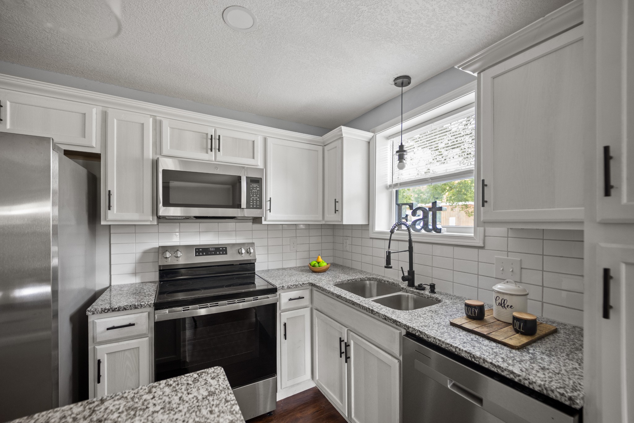 712 Westside Drive Tullahoma, TN 37388 - Photo 11 of 28 a kitchen with a sink stove top oven and refrigerator