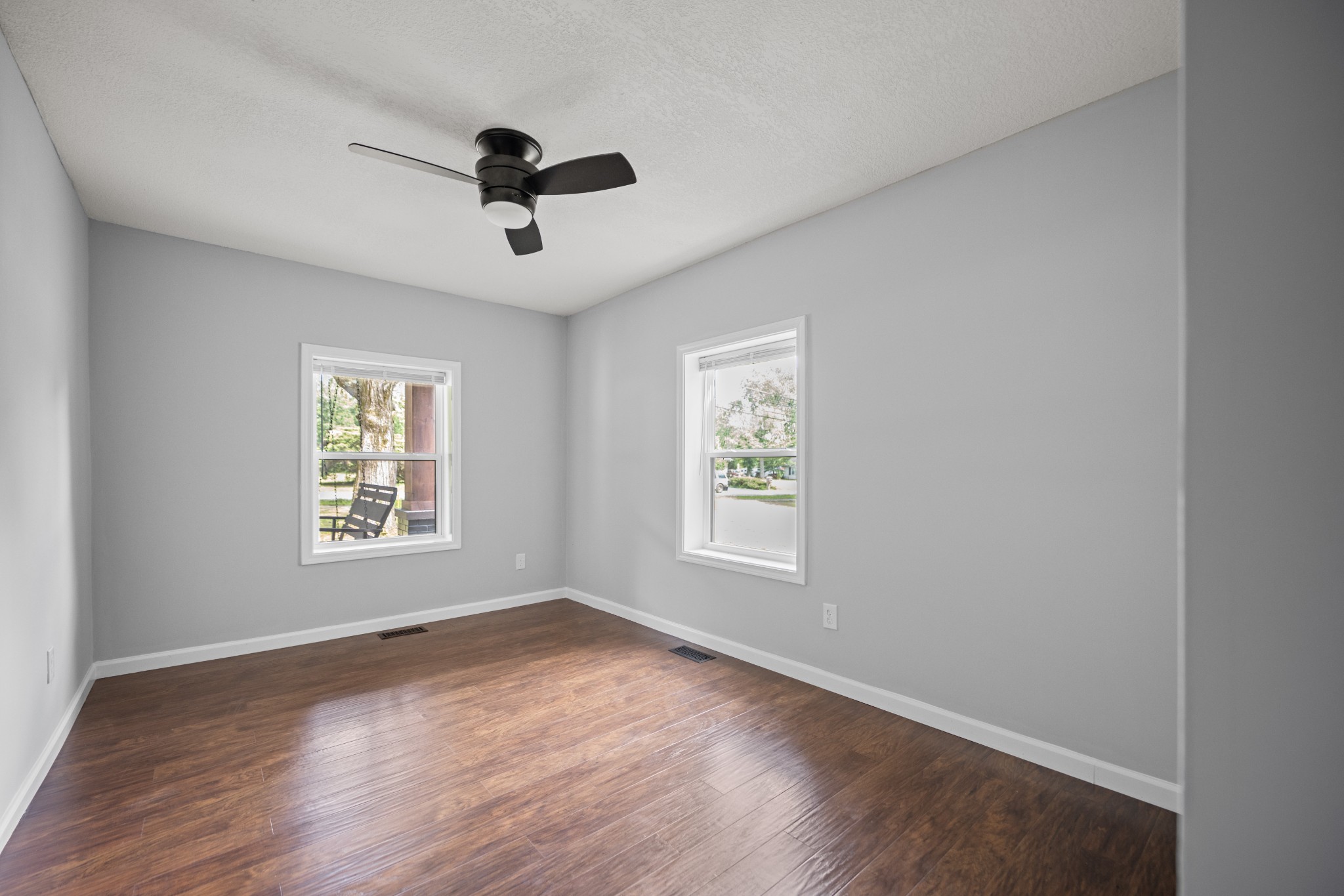 712 Westside Drive Tullahoma, TN 37388 - Photo 12 of 28 a view of an empty room with wooden floor and a window