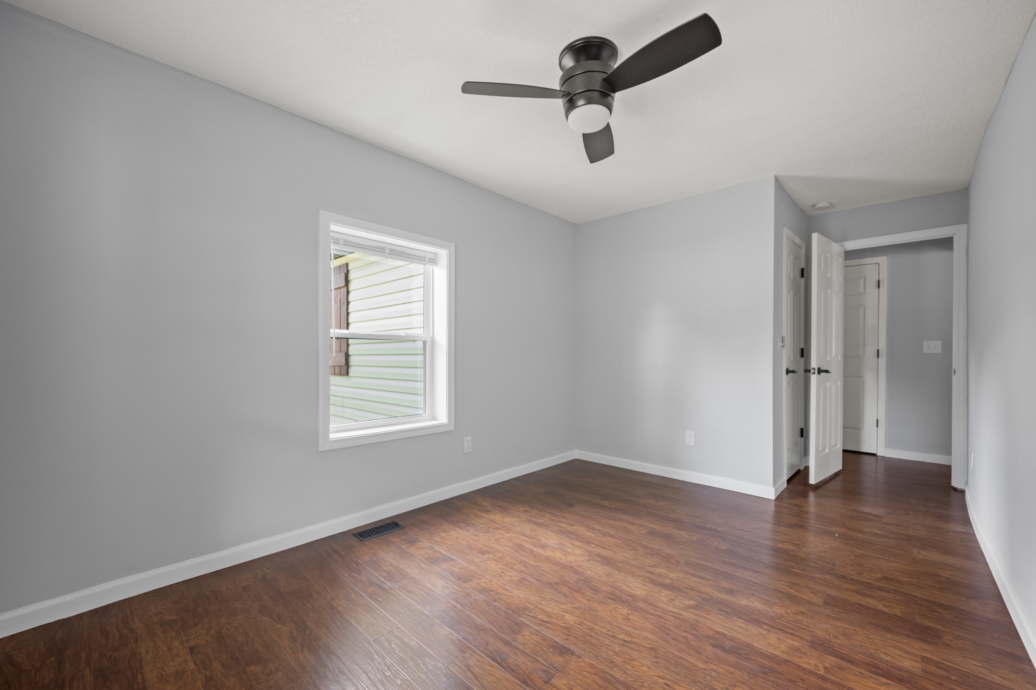 712 Westside Drive Tullahoma, TN 37388 - Photo 13 of 28 wooden floor in an empty room with a window
