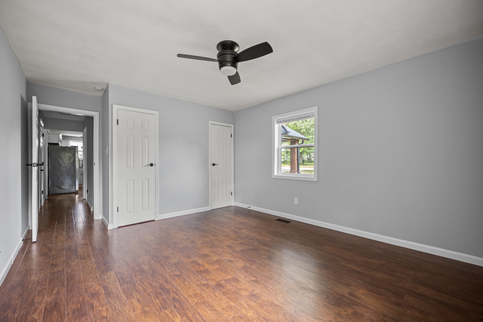 712 Westside Drive Tullahoma, TN 37388 - Photo 17 of 28 wooden floor in an empty room with a window
