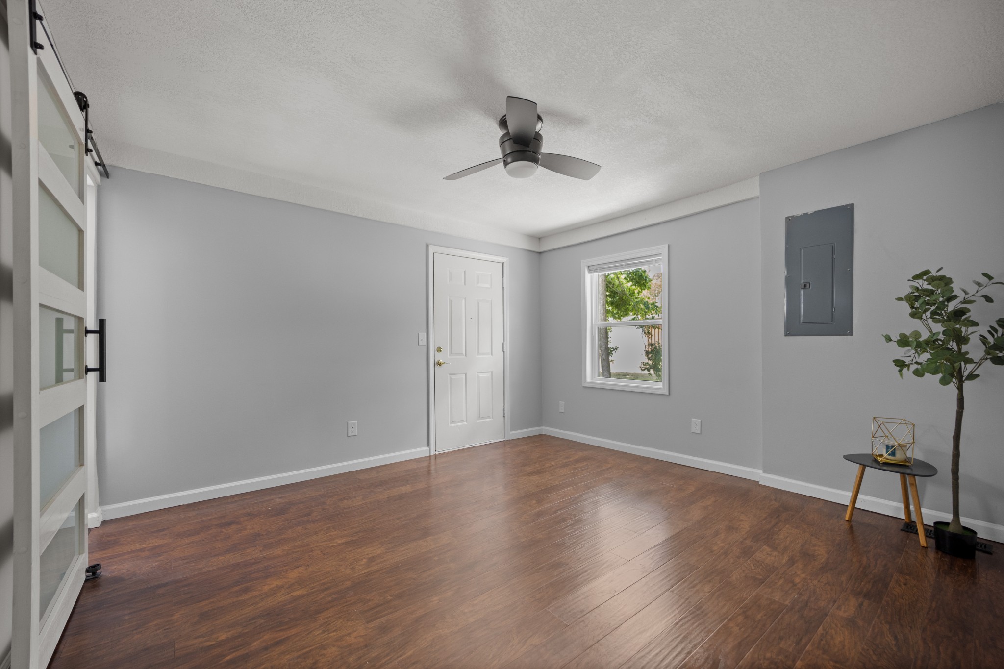 712 Westside Drive Tullahoma, TN 37388 - Photo 18 of 28 a view of an empty room with a window and wooden floor