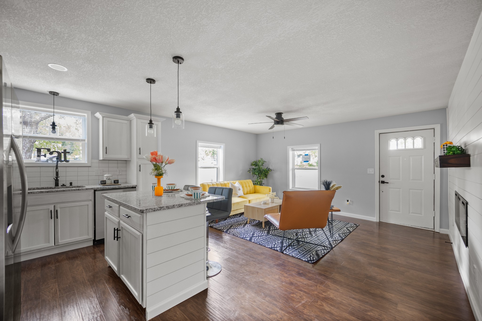 712 Westside Drive Tullahoma, TN 37388 - Photo 7 of 28 a kitchen with stainless steel appliances granite countertop a sink dishwasher a stove and a refrigerator with wooden floor