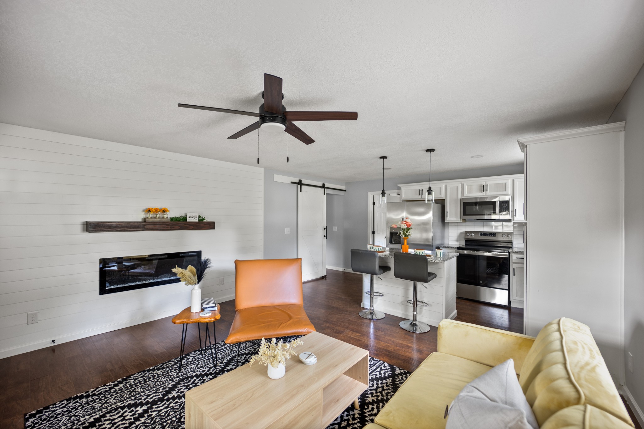 712 Westside Drive Tullahoma, TN 37388 - Photo 8 of 28 a living room with furniture a rug and a chandelier