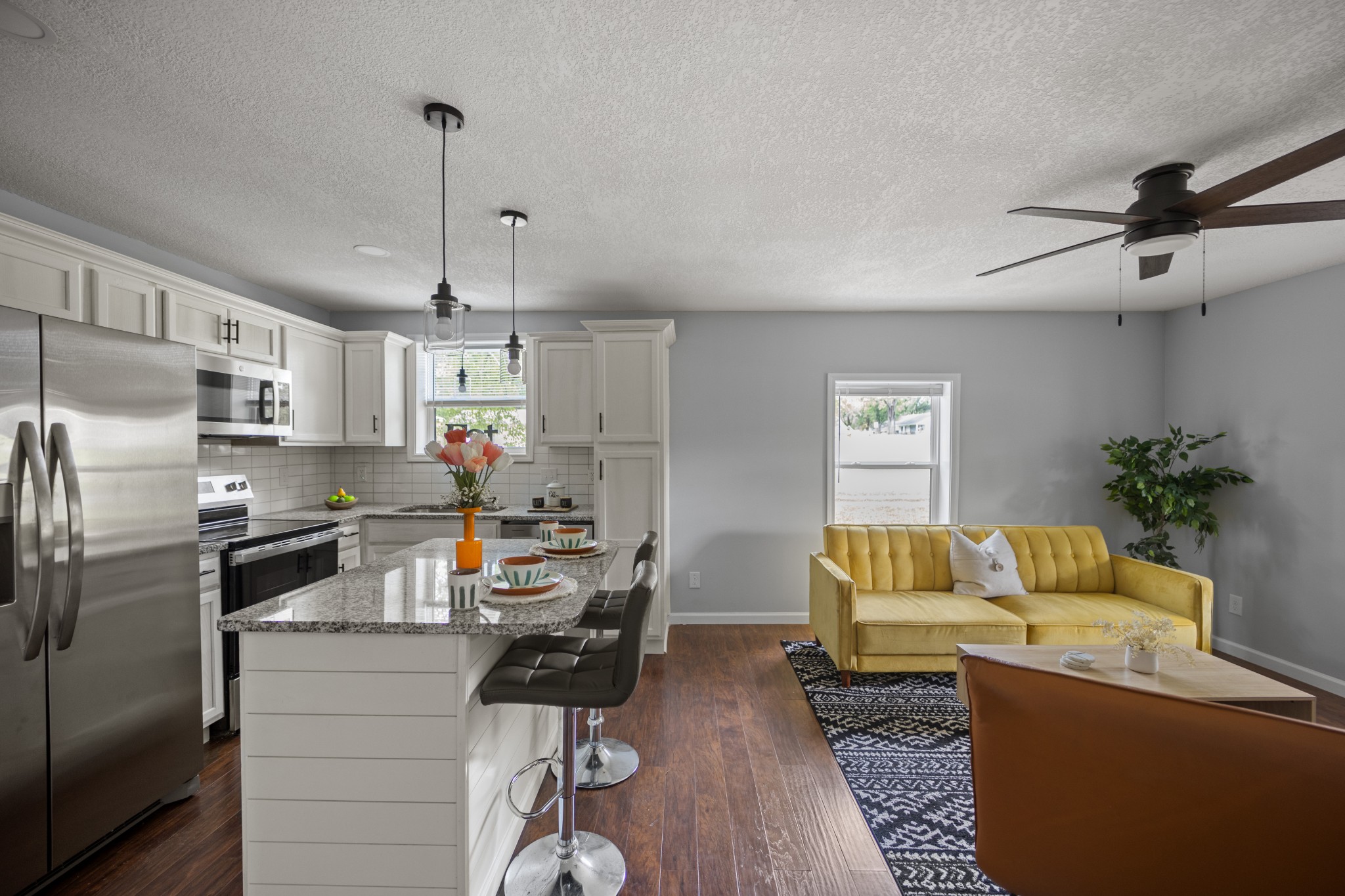 712 Westside Drive Tullahoma, TN 37388 - Photo 9 of 28 a living room with stainless steel appliances furniture a couch and a chandelier