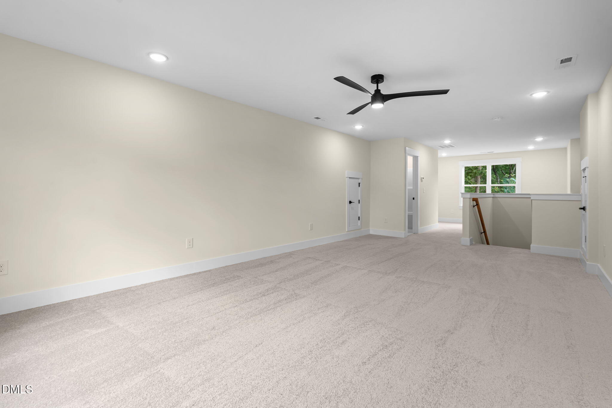 188 Landon Ridge Sanford, NC 27330 - Photo 16 of 44 an empty room with a ceiling fan and window