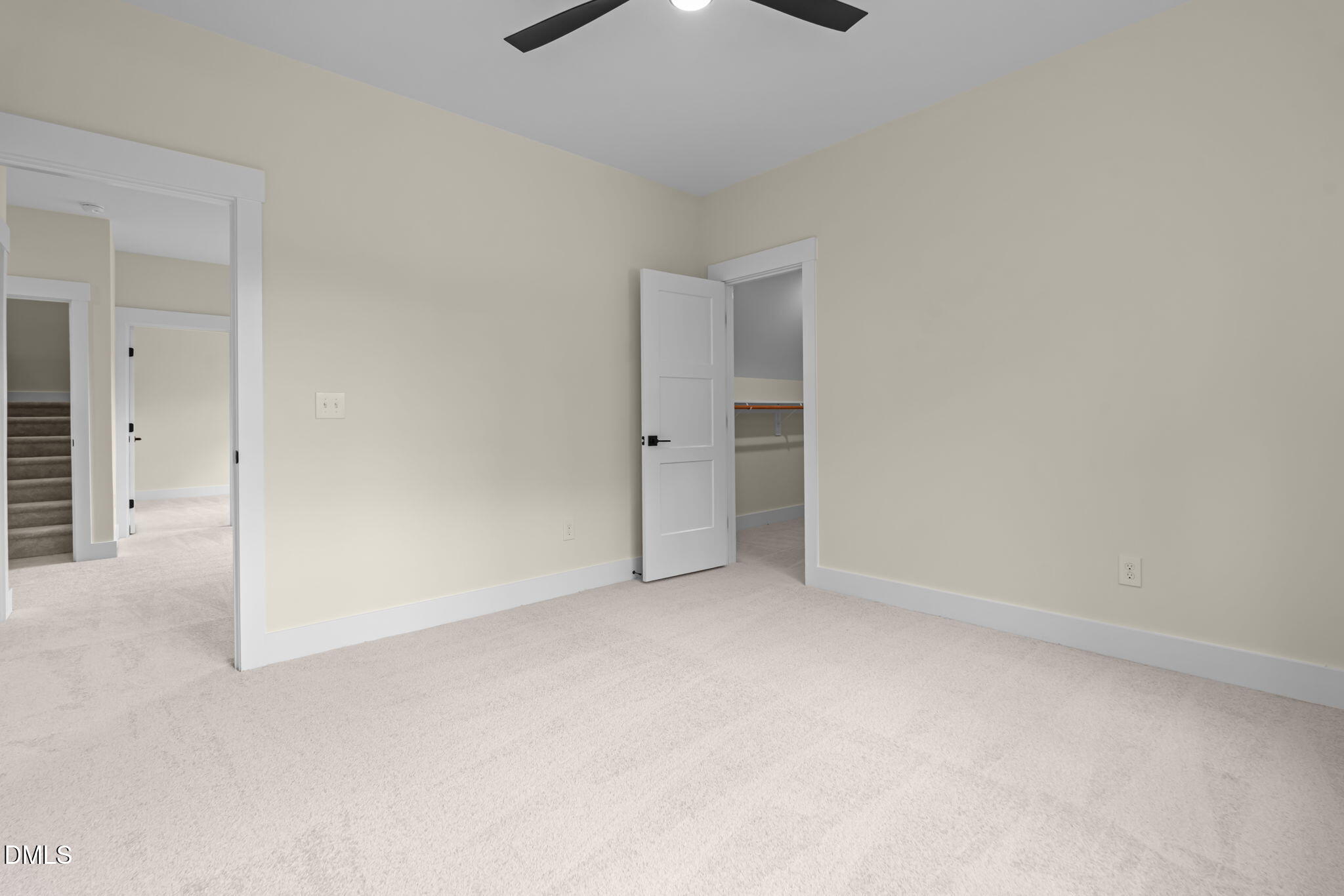 188 Landon Ridge Sanford, NC 27330 - Photo 20 of 44 an empty room with an entryway and chandelier