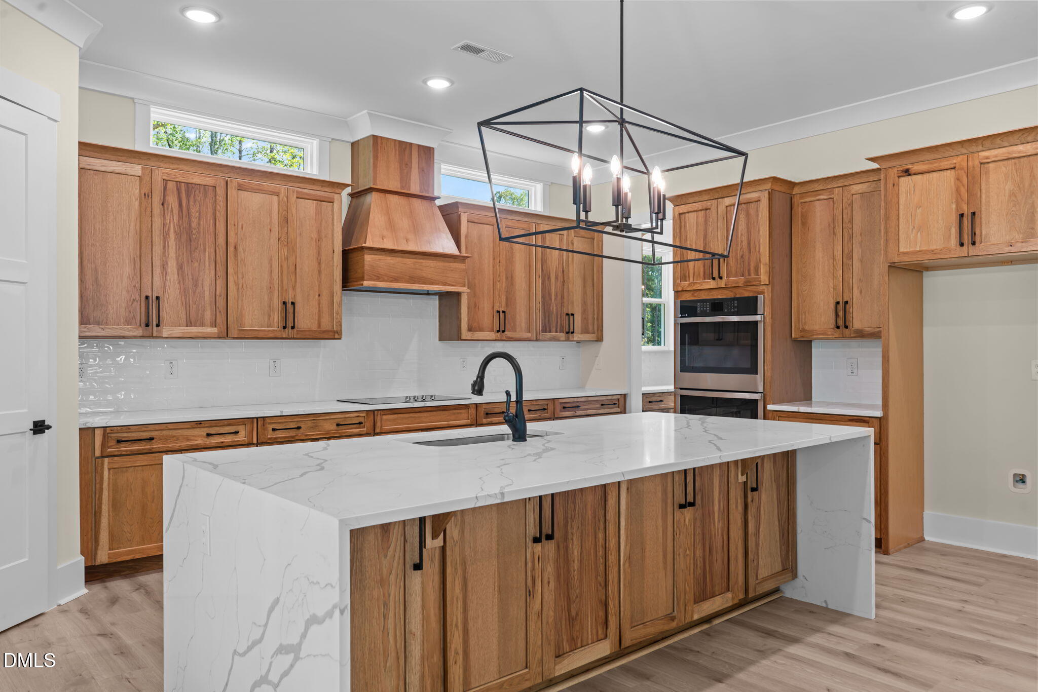 188 Landon Ridge Sanford, NC 27330 - Photo 2 of 44 a kitchen with stainless steel appliances granite countertop a sink refrigerator and microwave
