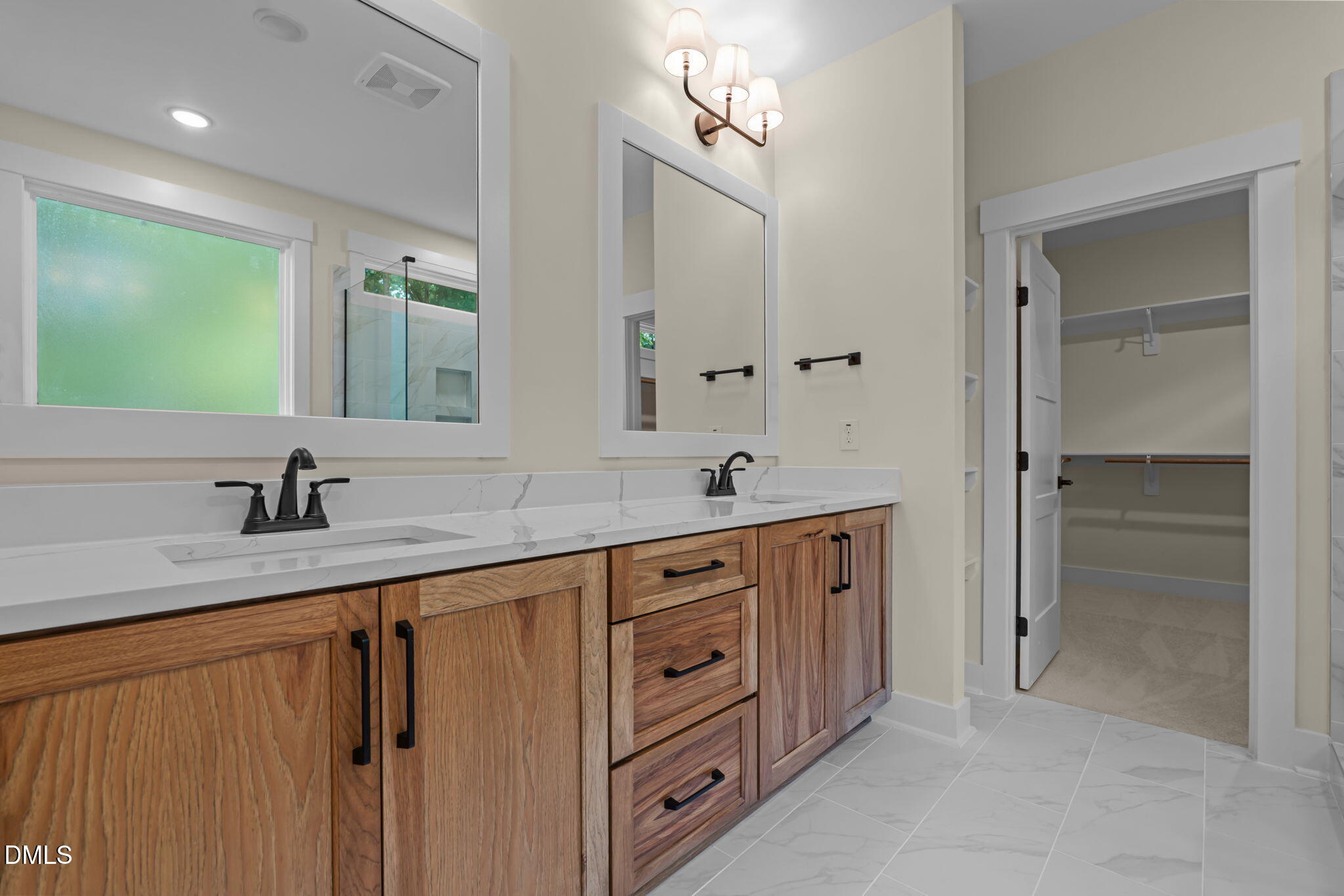 188 Landon Ridge Sanford, NC 27330 - Photo 25 of 44 a spacious bathroom with double sink a mirror and a shower