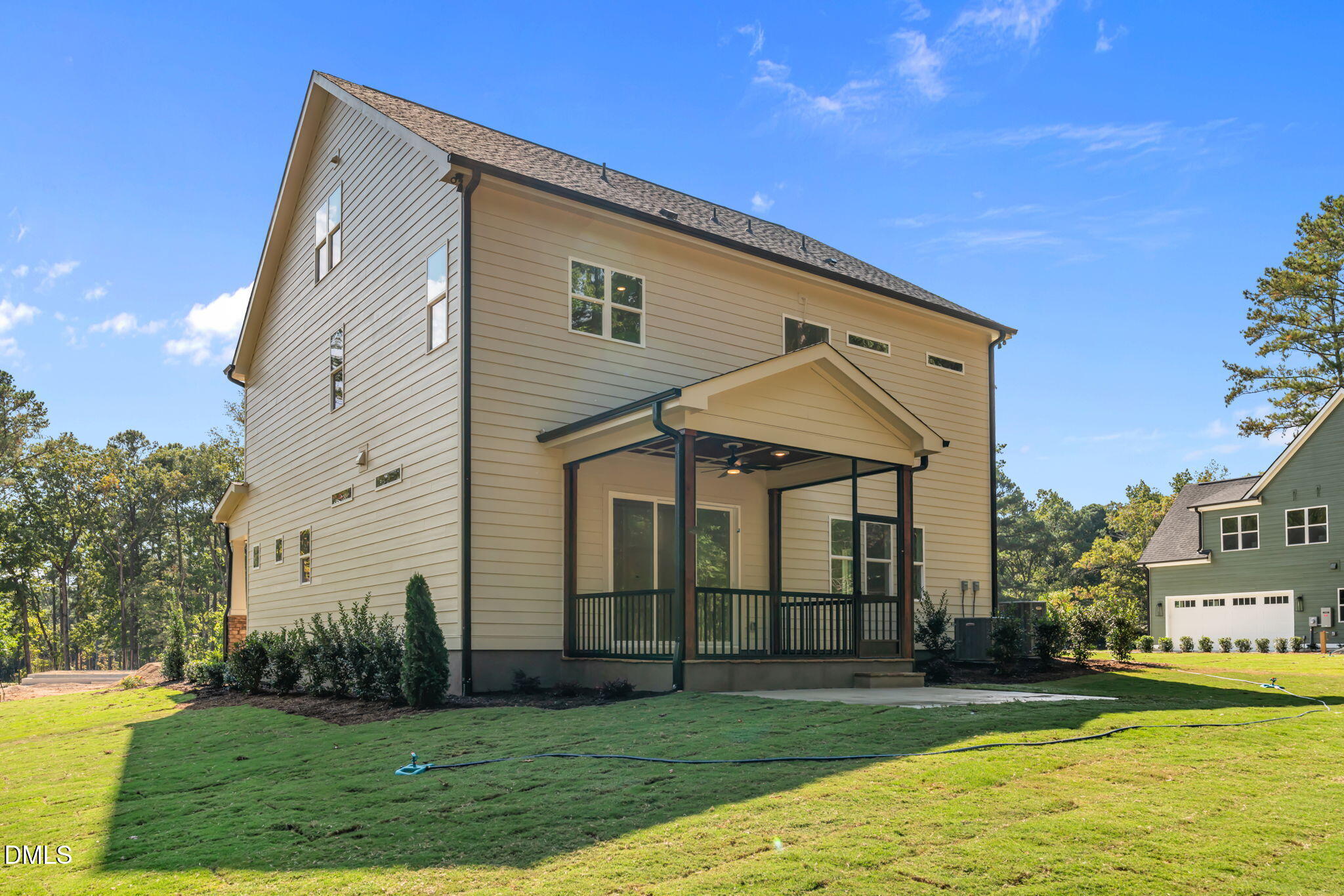 188 Landon Ridge Sanford, NC 27330 - Photo 35 of 44 a view of a white house next to a yard with big trees