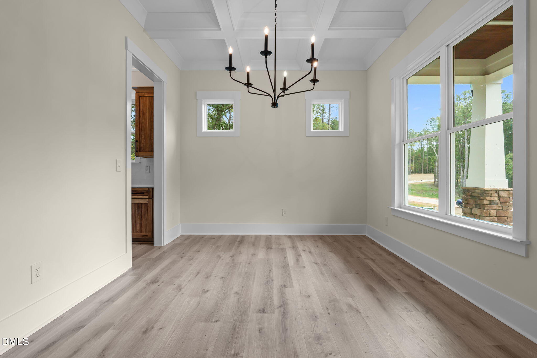188 Landon Ridge Sanford, NC 27330 - Photo 7 of 44 a view of empty room with wooden floor and chandelier