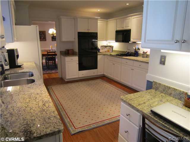 2111 Winterfield Road Midlothian, VA 23113 - Photo 3 of 12 a kitchen with a sink stove and refrigerator