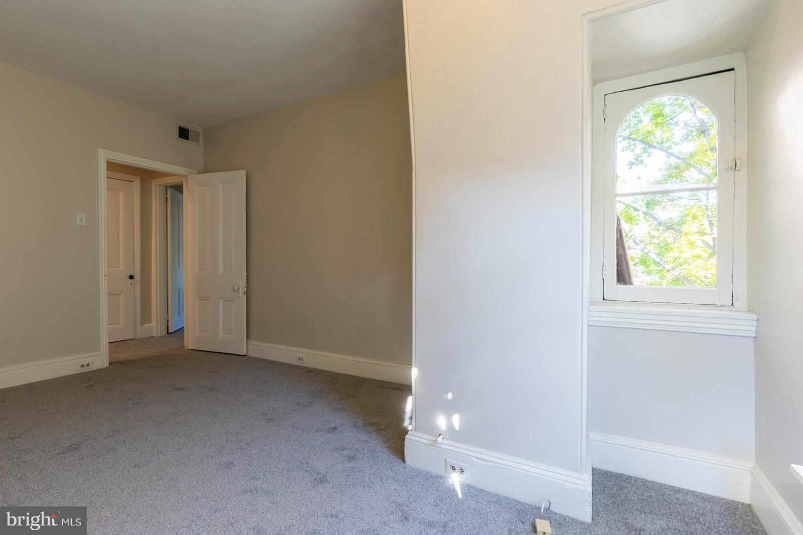 3604 Baring Street, Unit 2 Philadelphia, PA 19104 - Photo 13 of 25 an empty room with windows