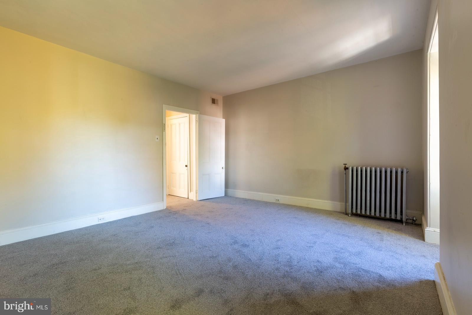3604 Baring Street, Unit 2 Philadelphia, PA 19104 - Photo 17 of 25 an empty room with floor to ceiling window