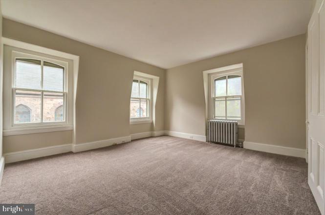 3604 Baring Street, Unit 2 Philadelphia, PA 19104 - Photo 18 of 22 an empty room with windows