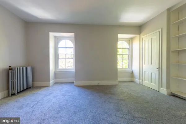 an empty room with windows