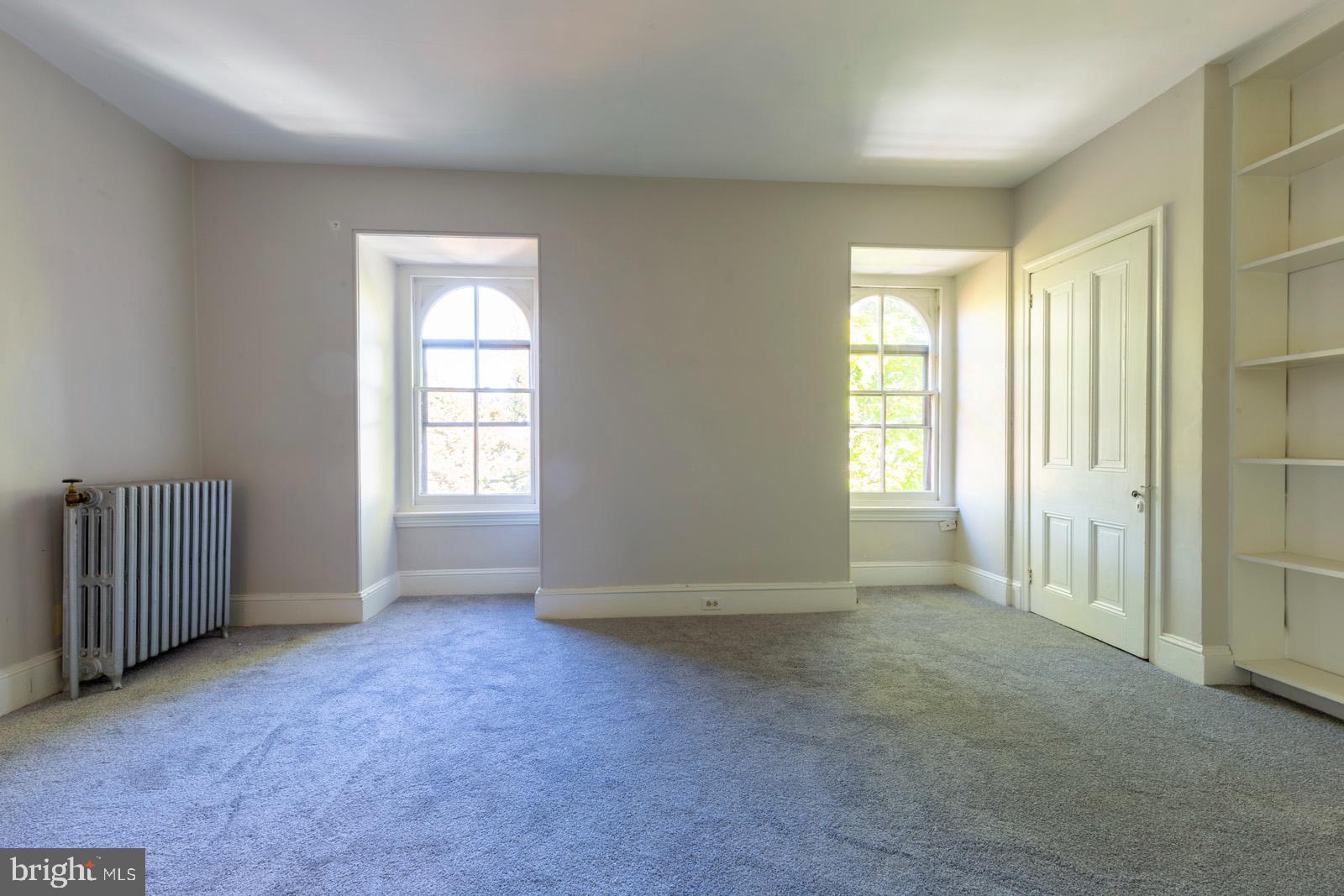 3604 Baring Street, Unit 2 Philadelphia, PA 19104 - Photo 19 of 25 an empty room with windows
