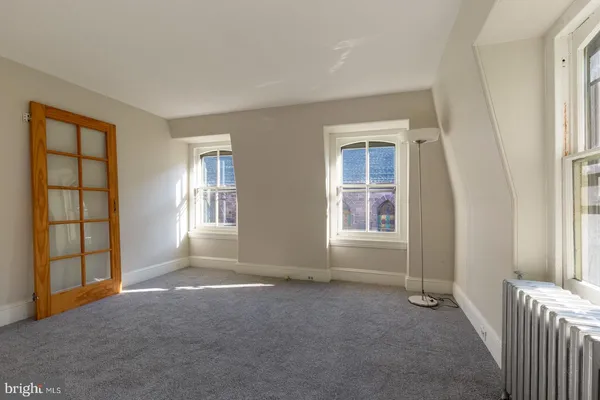 an empty room with windows