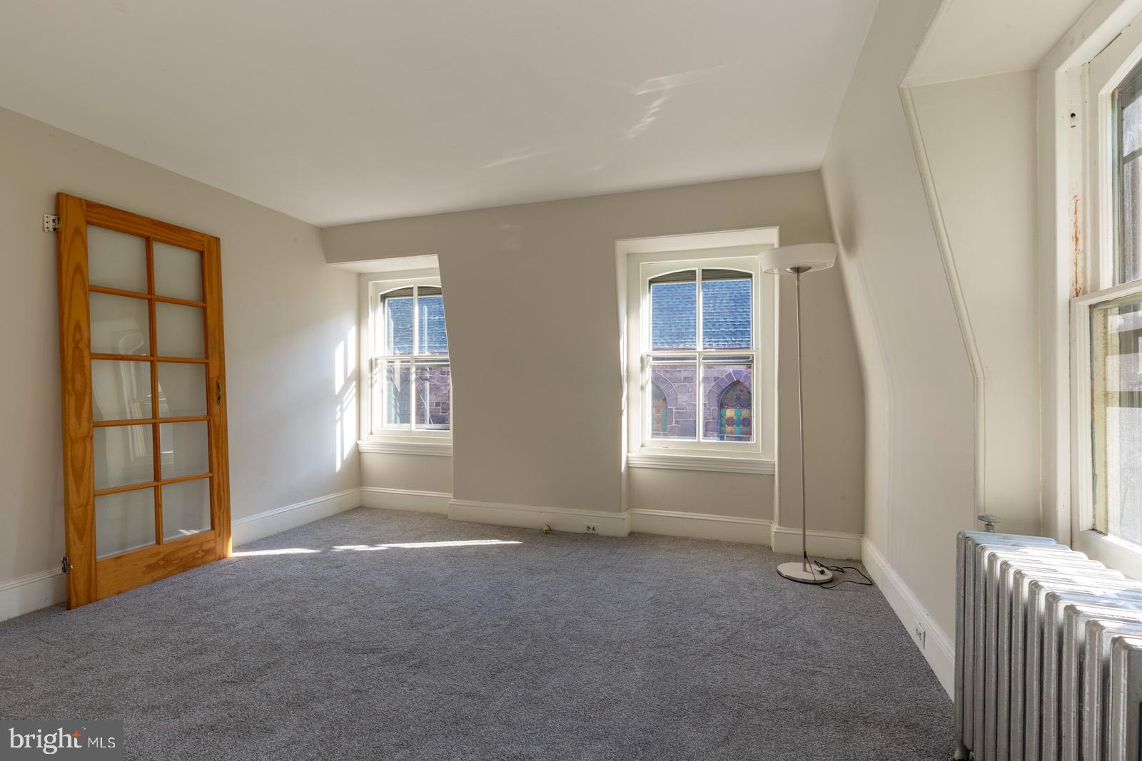 3604 Baring Street, Unit 2 Philadelphia, PA 19104 - Photo 5 of 22 an empty room with windows