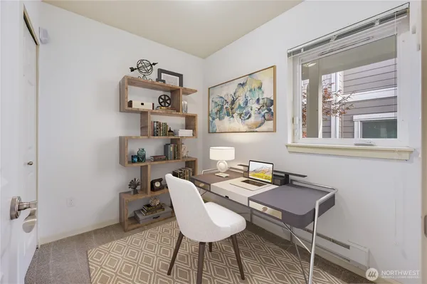 a workspace with furniture and window